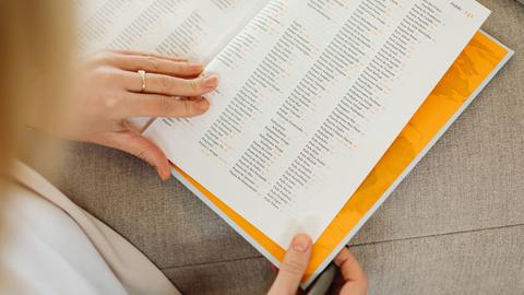 a person reading a book index