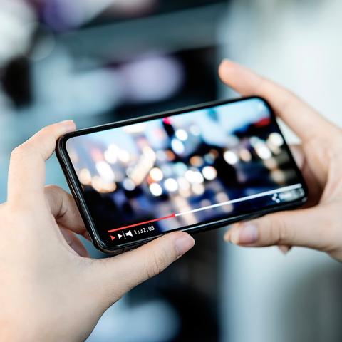 a person watching a video on a phone