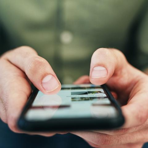 a person using a cell phone